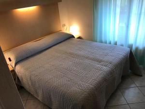 Postel nebo postele na pokoji v ubytování Hotel B&B Rispescia Grosseto