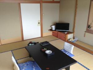 Телевизор и/или развлекательный центр в Inatori Tokai Hotel Yuen
