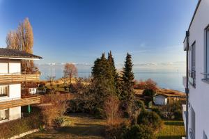 a view of the water from a house at Haus Bank-Specker in exclusiver Seelage in Immenstaad am Bodensee