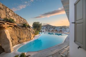 a view of a swimming pool in a resort at Deliades Hotel in Ornos