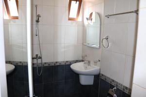 a bathroom with a sink and a shower at семеен хотел Визаж in Yambol
