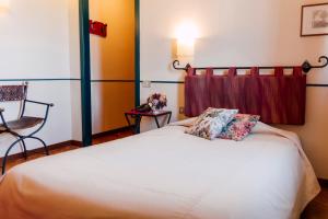 Postel nebo postele na pokoji v ubytování Hostellerie Du Golf