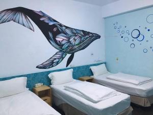 Postelja oz. postelje v sobi nastanitve Light Blue Hostel