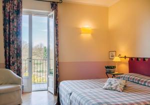 Postel nebo postele na pokoji v ubytování Hostellerie Du Golf
