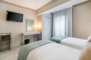 Postel nebo postele na pokoji v ubytování Boutique Hotel B51