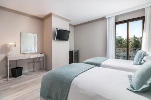 Postel nebo postele na pokoji v ubytování Boutique Hotel B51