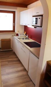 Kuchyň nebo kuchyňský kout v ubytování Sunshine Appartements