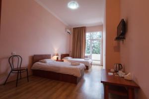Postel nebo postele na pokoji v ubytování Ortachala Palace + 37 fotografií