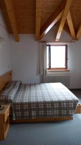 Postel nebo postele na pokoji v ubytování Hotel Melchiori