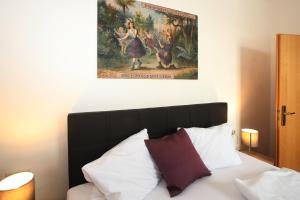 Łóżko lub łóżka w pokoju w obiekcie City Apartments Mozart
