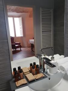 a bathroom with a sink and a mirror at La Dimora del Falconiere - Luxury Suites in Sulmona +51 photos