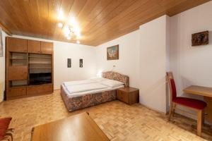 Кровать или кровати в номере Haus Moosmann
