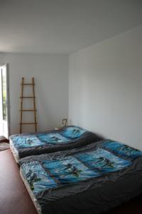 מיטה או מיטות בחדר ב-l'ecrin bleu