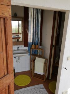 a small bathroom with a sink and a mirror at Agriturismo Elianto in Ravenna
