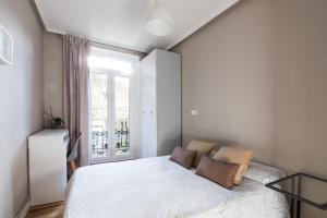 Posteľ alebo postele v izbe v ubytovaní Downtown apartment