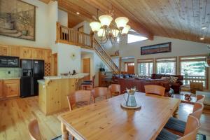 a kitchen and living room with a wooden table and chairs at 14 Goldfinch in Sunriver