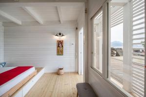 Postel nebo postele na pokoji v ubytování Maresia Rooms