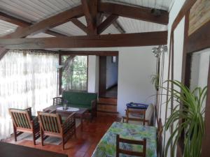 a living room with chairs and a table at B&B La Viderente in Saussignac