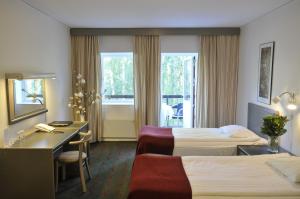 Postel nebo postele na pokoji v ubytování Ariston Hotell + 37 fotografií