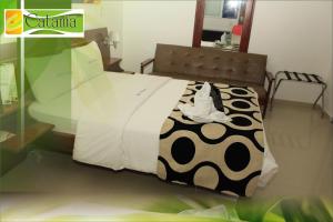 Postel nebo postele na pokoji v ubytování Hotel Catama Inn