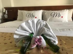 Postel nebo postele na pokoji v ubytování Hotel Catama Inn