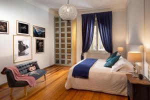 A bed or beds in a room at Daplace - Renzo Apartment