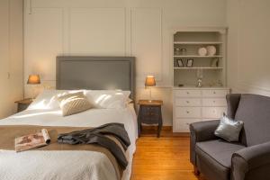 A bed or beds in a room at Daplace - Renzo Apartment