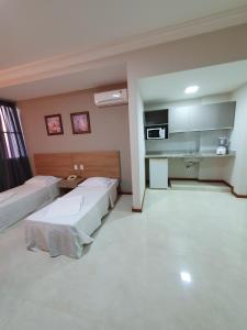 Η κουζίνα ή μικρή κουζίνα στο Guaratur Hotel