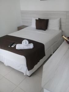 Łóżko lub łóżka w pokoju w obiekcie Mintaka Hotel + Lounge