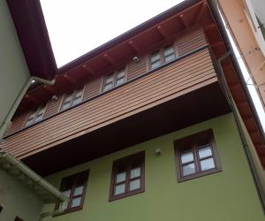 a building with awning on the side of it at Villa Cudillero - recep H Isabel in Cudillero