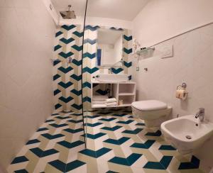 a bathroom with a toilet and a sink at Sorrento Flats in Sorrento