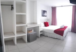 Voodi või voodid majutusasutuse Mintaka Hotel + Lounge toas