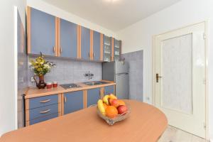 Kuchyň nebo kuchyňský kout v ubytování Apartmani Miluška