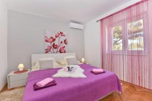 Postel nebo postele na pokoji v ubytování Apartmani Miluška