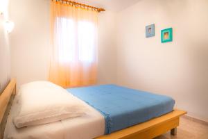 Postel nebo postele na pokoji v ubytování Silver Beach Apartments Vis