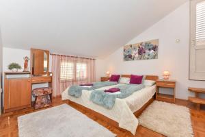 Postel nebo postele na pokoji v ubytování Apartmani Miluška