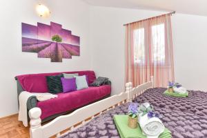 Postel nebo postele na pokoji v ubytování Apartmani Miluška