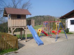 a playground with a slide and a play structure at Holiday home in Rattersberg Bavaria with terrace in Viechtach