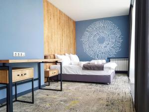 Voodi või voodid majutusasutuse Hotel Alpha toas