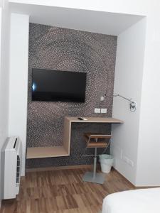 Televiisor ja/või meelelahutuskeskus majutusasutuses h-sa GUEST HOUSE