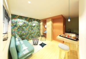 a living room with a couch and a kitchen at Studio Design Paraisos in Lyon