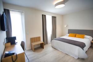 Posteľ alebo postele v izbe v ubytovaní Villa Lucerna Sports & Hotel Resort