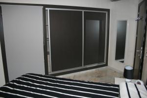 a bedroom with a large sliding glass door at La Siesta Beach Resort in Mohammedia