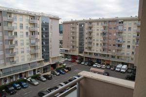 a view of a parking lot from a balcony at Oaza apartment in Podgorica