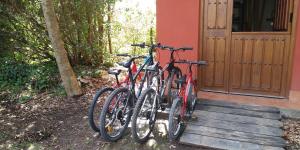 two bikes parked in front of a house at Apartamentos Rurales La Fuente de Báscones in Villahormes
