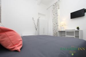 Postel nebo postele na pokoji v ubytování Palermo Inn Suite