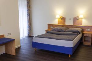Postel nebo postele na pokoji v ubytování Hotel Restaurant Waldlust