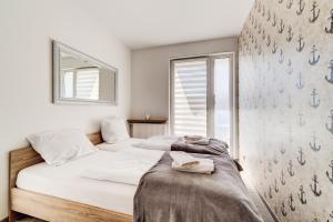 Posteľ alebo postele v izbe v ubytovaní Apartamenty Sun & Snow Kopernika