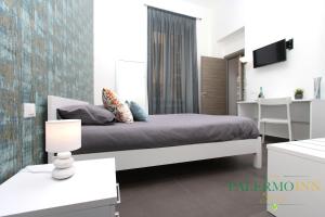 Postel nebo postele na pokoji v ubytování Palermo Inn Suite