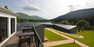 a balcony of a house with a view of the mountains at Bridge of Orchy Hotel in Bridge of Orchy +32 photos